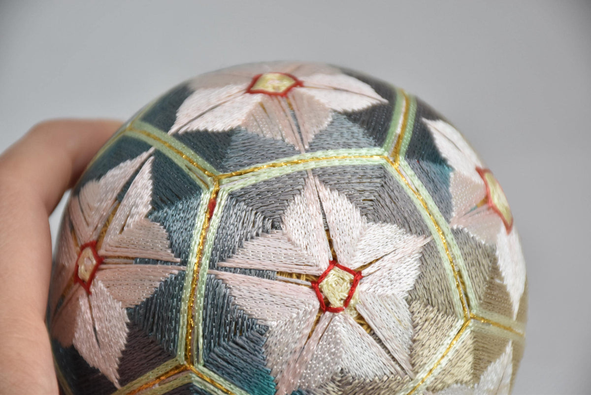 Hand-Embroidered Japanese Temari Folk Art Ball table scatters, close up held in hand