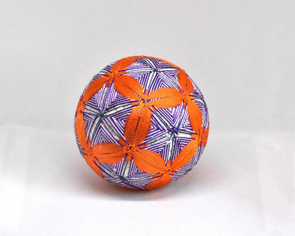 Hand-Embroidered Temari Ball Orange And Purple table scatter with intricate stitched geometric patterns