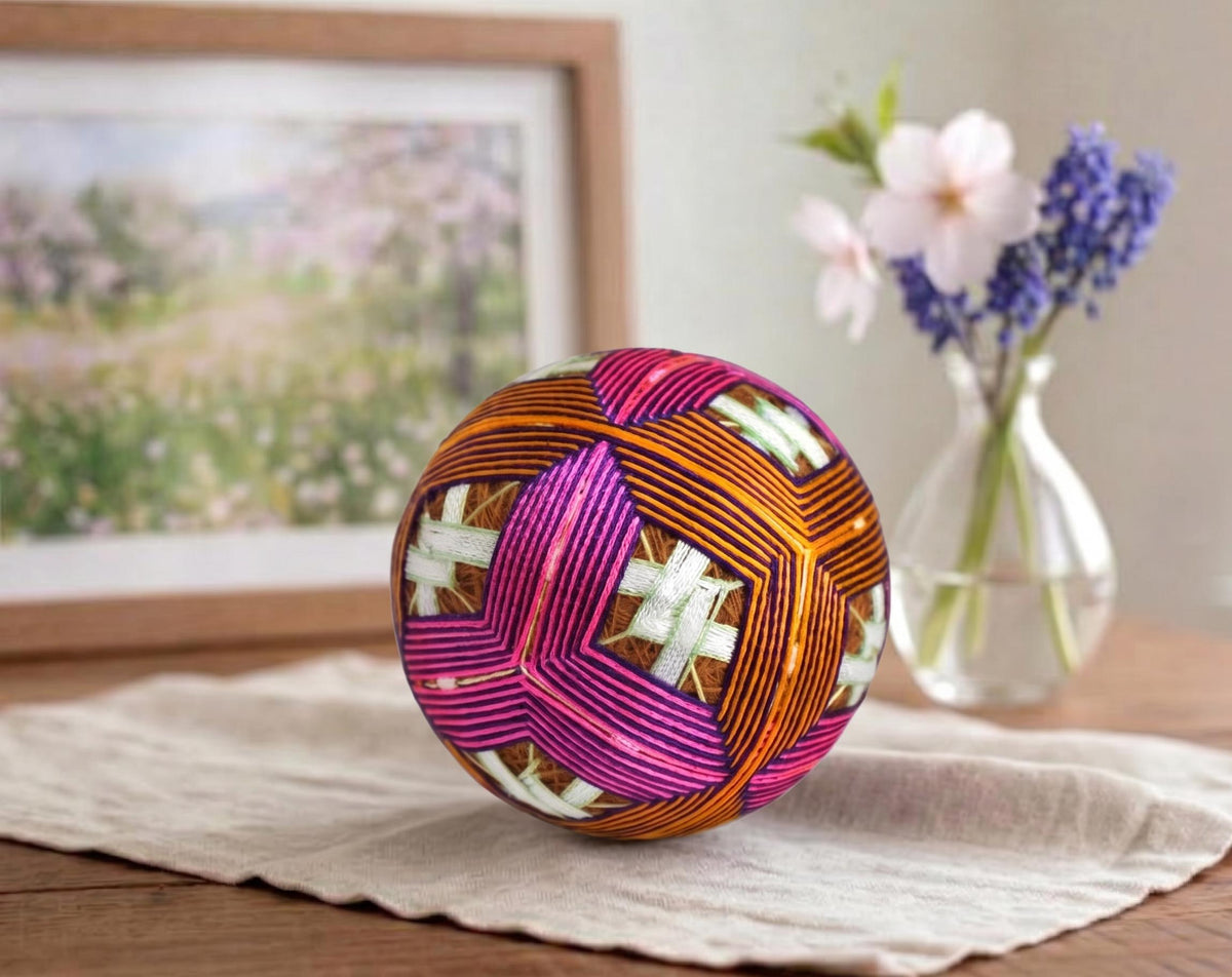 Hand-Embroidered Japanese Temari Ball Folk Art tabletop decor styled on cloth with flowers and framed art