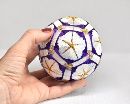 Hand-Embroidered Traditional Japanese Temari Ball shown next to a hand for size