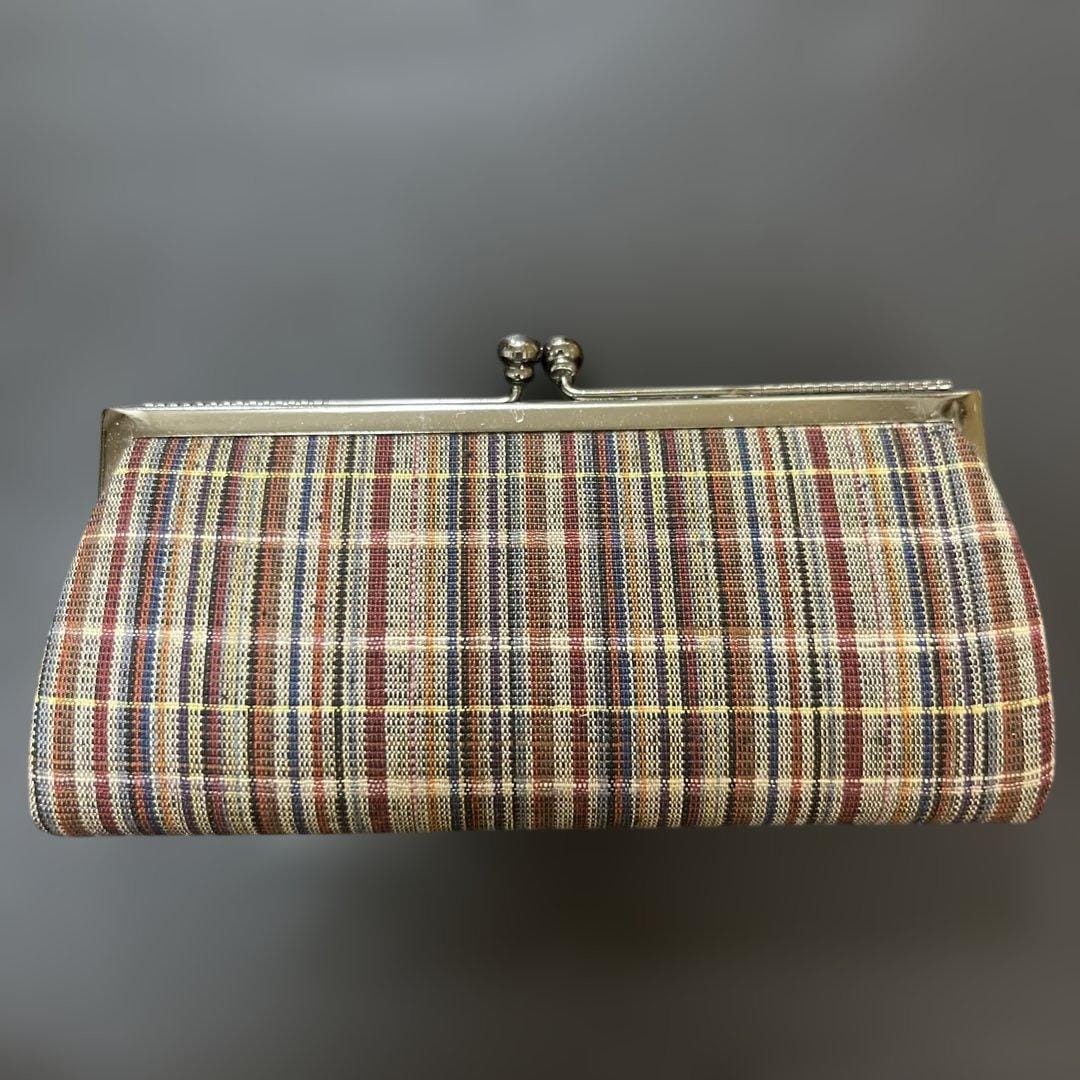 Ueda Tsumugi silk coin purse featuring a striped pattern and a metal kiss-lock clasp