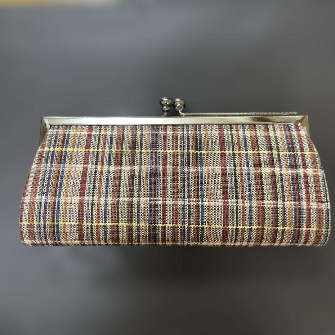 Ueda Tsumugi silk coin purse shown from the front with structured gamaguchi frame