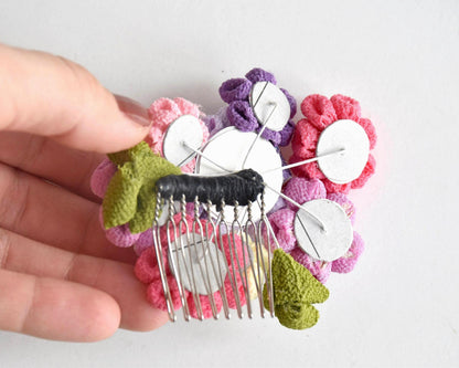 Tsumami-Zaiku Chirimen Crepe Flower Hair Comb showing the metal comb base and back structure held in a hand