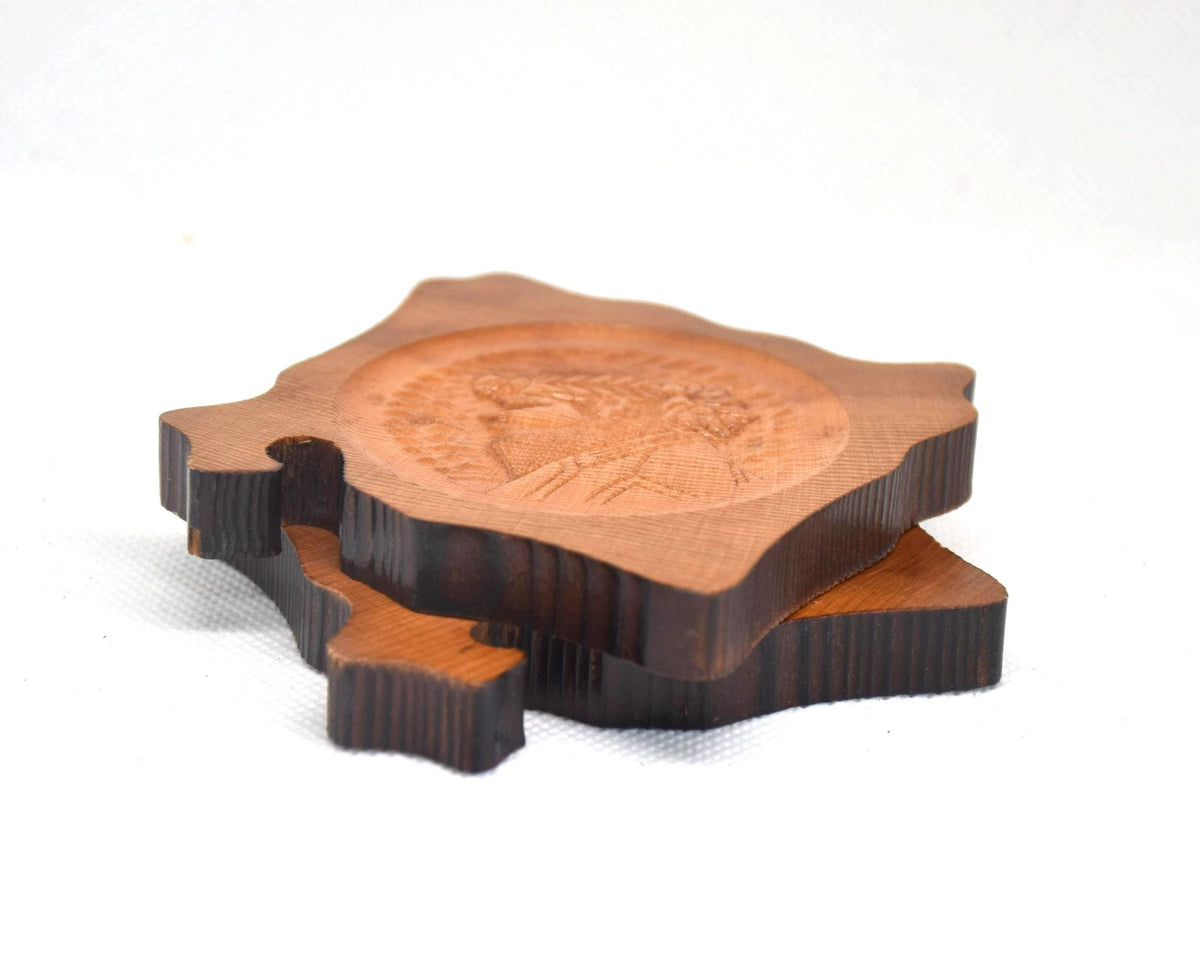 Ainu wooden coaster set stacked to show the irregular live-edge shapes together