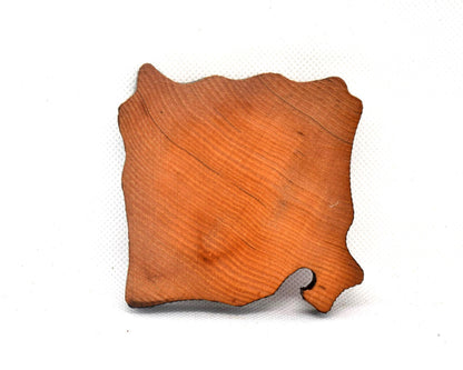 Ainu wooden coaster showing the plain uncarved natural wood back side