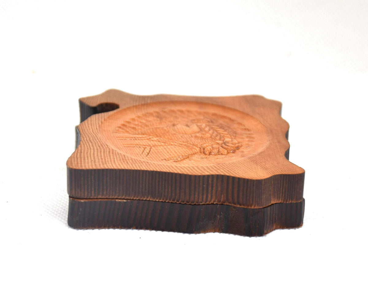 Ainu wooden coaster set stacked together showing side profiles and live-edge borders