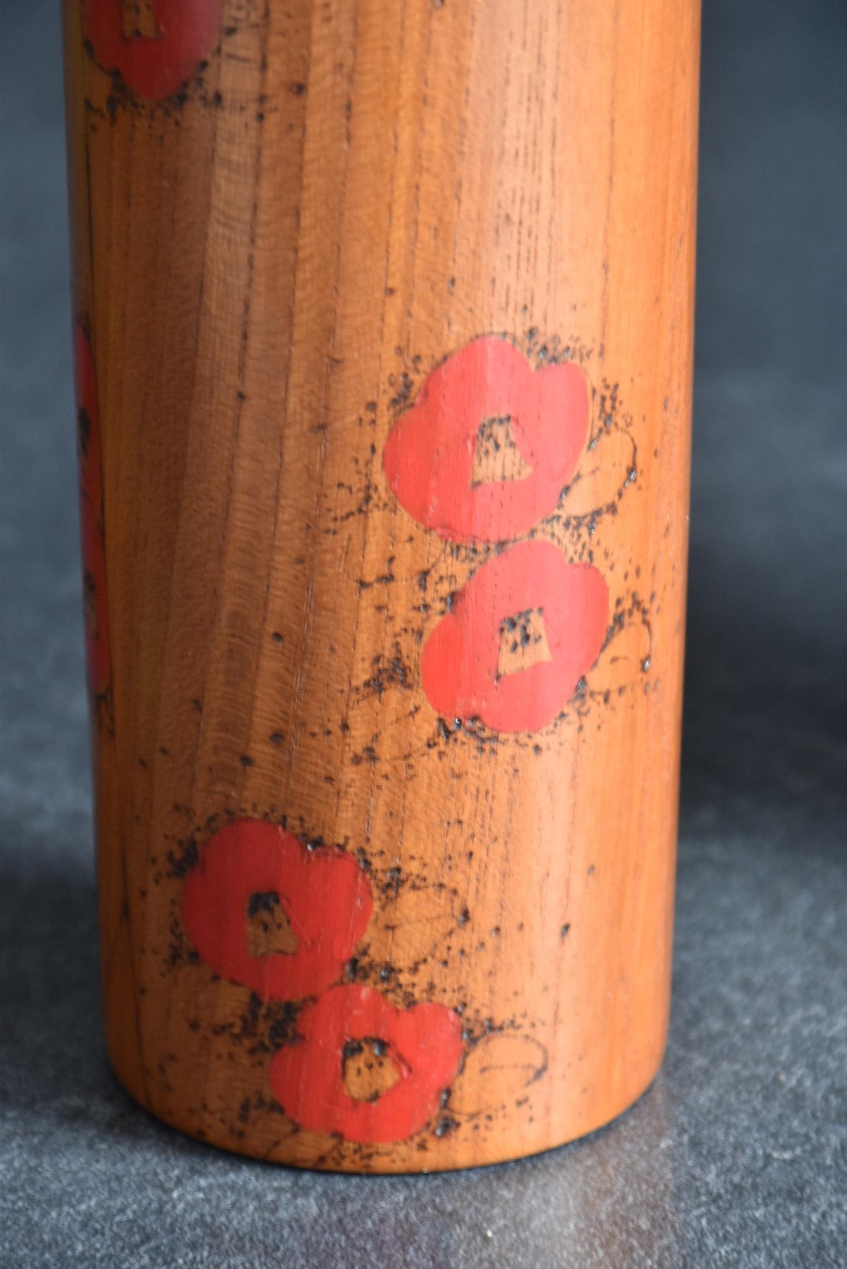 Toa Sekiguchi kokeshi doll body showing vibrant red camellia blossoms pattern detail