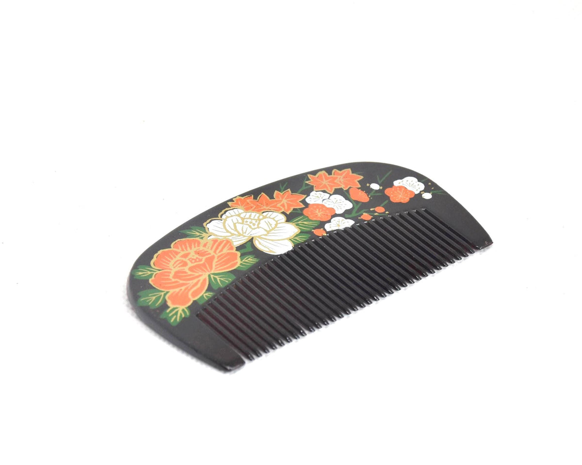 Japanese Black Lacquer Kushi Comb showing pattern detail of peony and plum blossoms