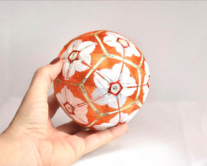 Hand-Embroidered Japanese Temari Ball Folk Art shown held next to a hand for scale