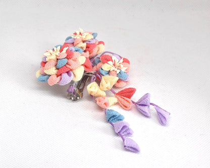 Chirimen Crepe Tsumami-Zaiku Floral Kanzashi Barette shown from the side with dangling petal accents