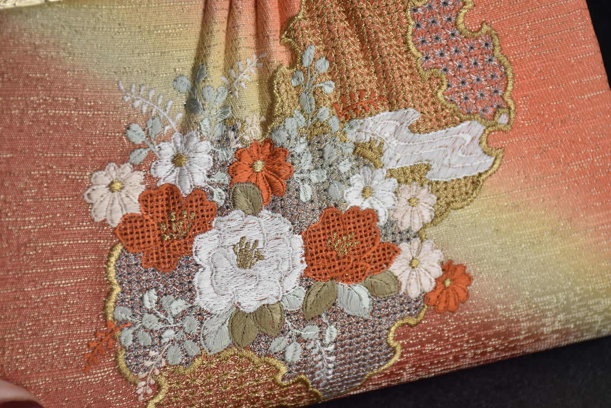 Floral Woven Kimono Clutch detail of the embroidered floral pattern on the front