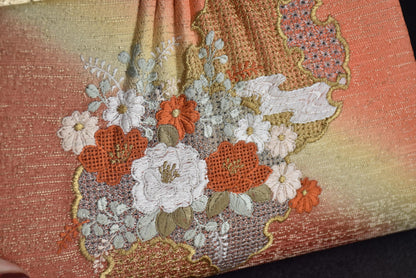 Floral Woven Kimono Clutch detail of the embroidered floral pattern on the front