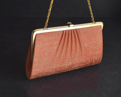 Floral Woven Kimono Clutch shown from the back with textured pink fabric and pleating
