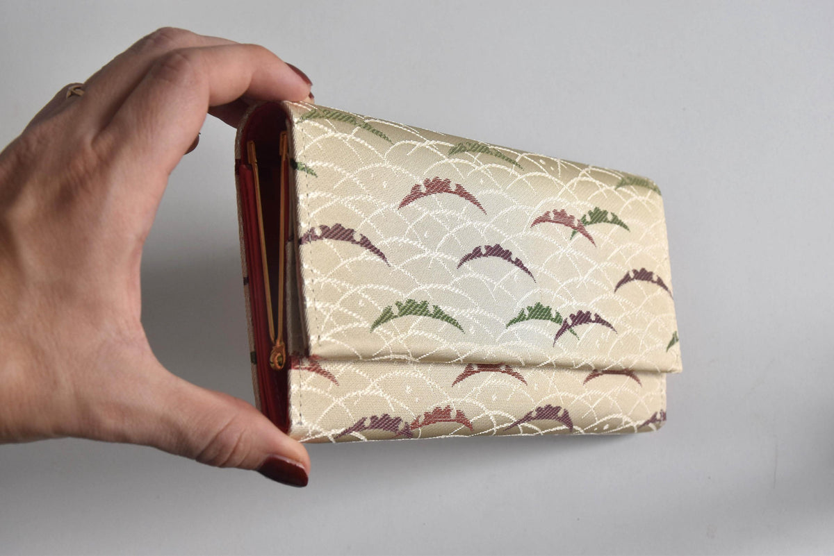 Shiseido Japanese Kimono Clutch With Traditional Weaves held against a light background