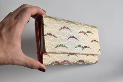 Shiseido Japanese Kimono Clutch With Traditional Weaves held against a light background