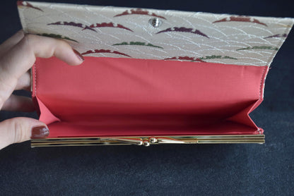 Shiseido Japanese Kimono Clutch With Traditional Weaves inside view showing coral lining