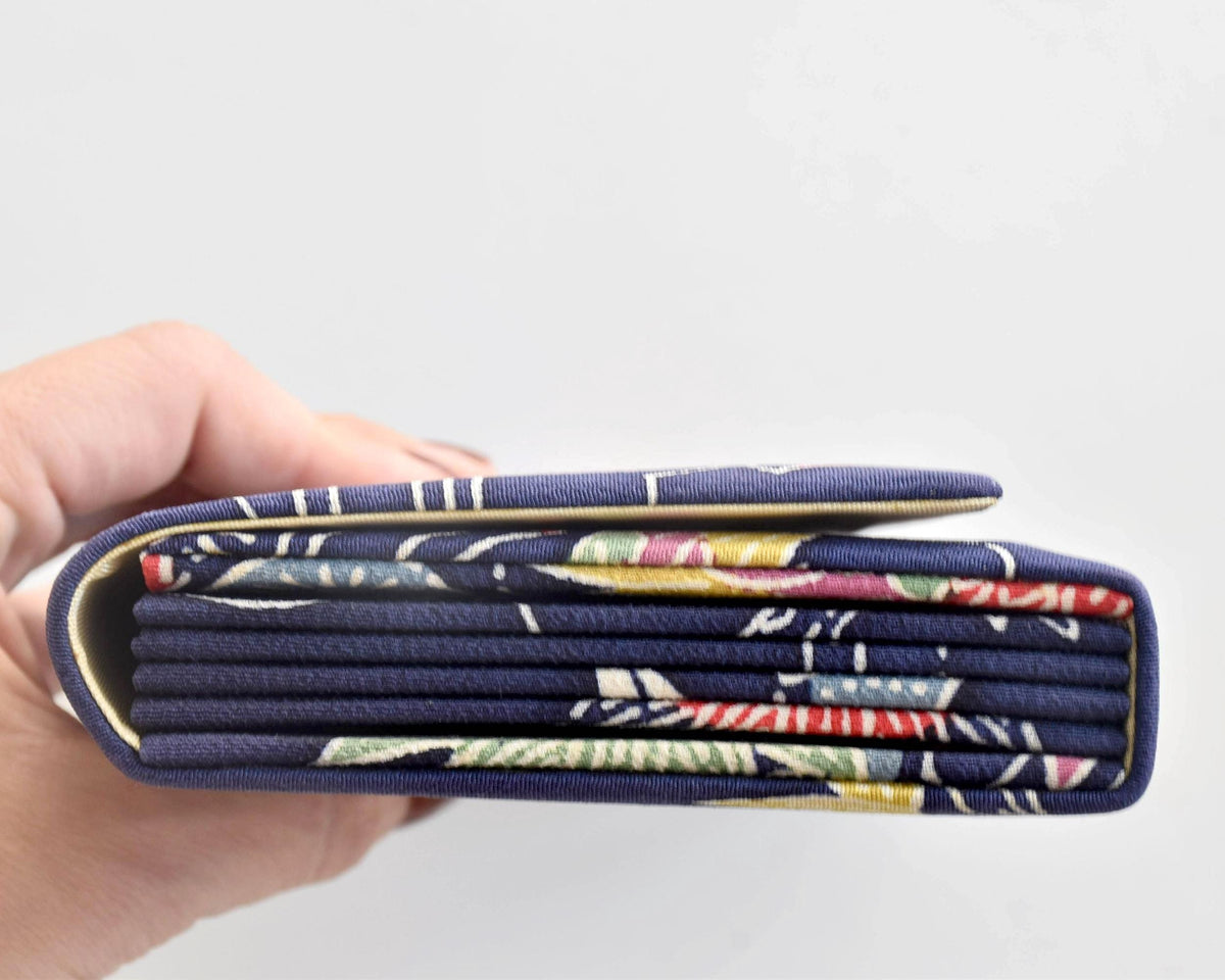 Navy Chirimen Kimono Clutch With Tsuru Crane Motif side profile showing accordion folds