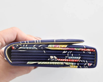 Navy Chirimen Kimono Clutch With Tsuru Crane Motif side profile showing accordion folds