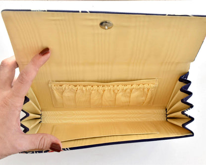 Navy Chirimen Kimono Clutch With Tsuru Crane Motif fully open showing satin interior and pockets
