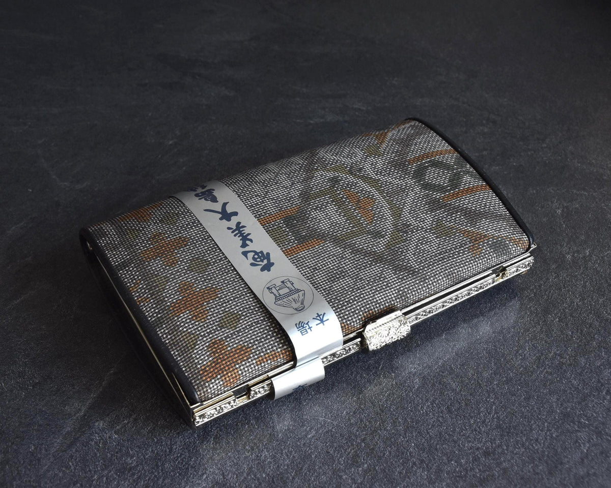 Amami Oshima Tsumugi silk clutch viewed from top with label wrapper