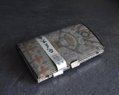 Amami Oshima Tsumugi silk clutch viewed from top with label wrapper
