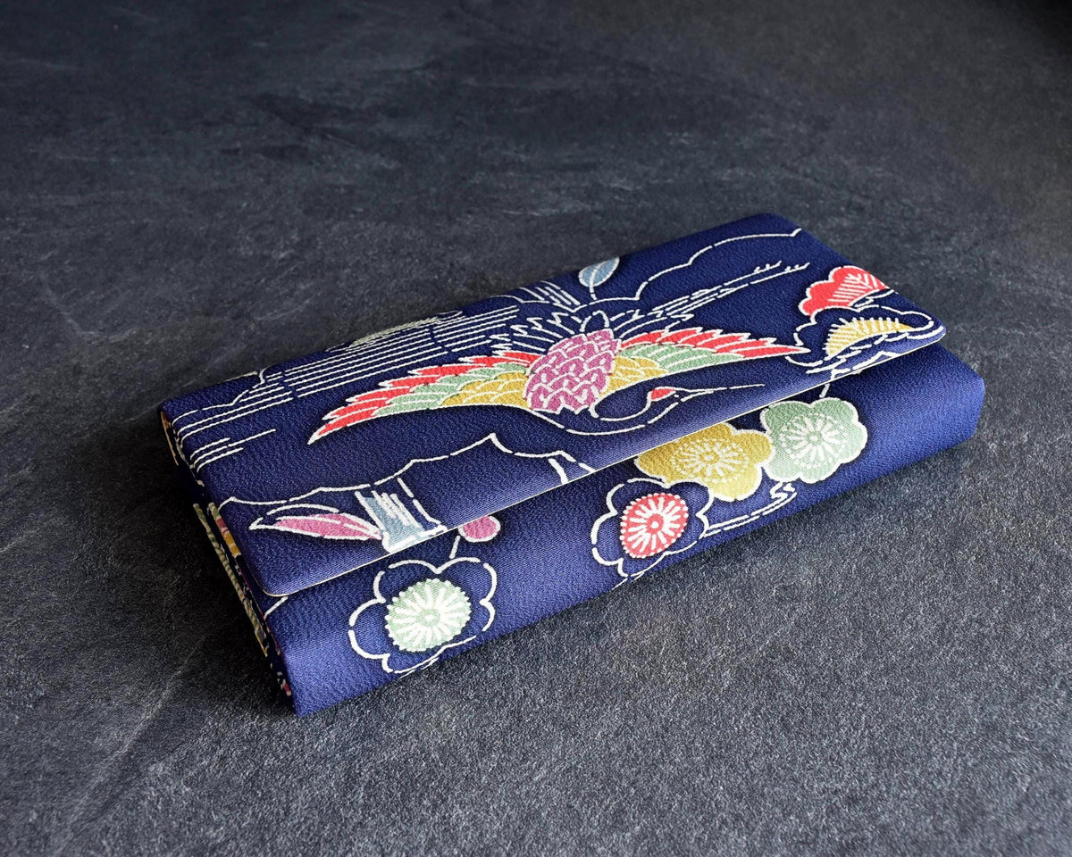 Navy Chirimen Kimono Clutch With Tsuru Crane Motif showing textured crepe fabric and front flap