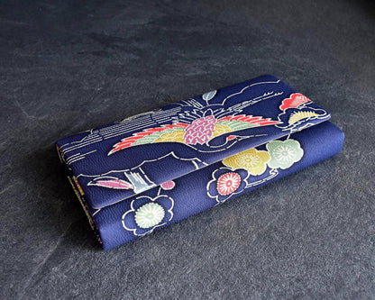 Navy Chirimen Kimono Clutch With Tsuru Crane Motif showing textured crepe fabric and front flap