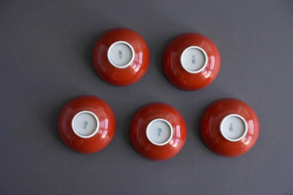 Koransha tea cup set showing the stamped artisan signature on the base of each porcelain bowl