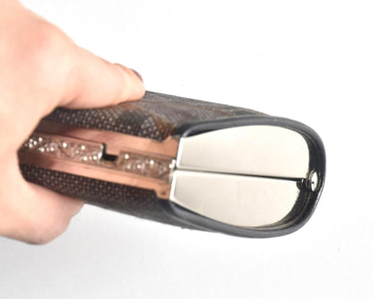 Amami Oshima Tsumugi silk clutch base held in hand showing bottom finish