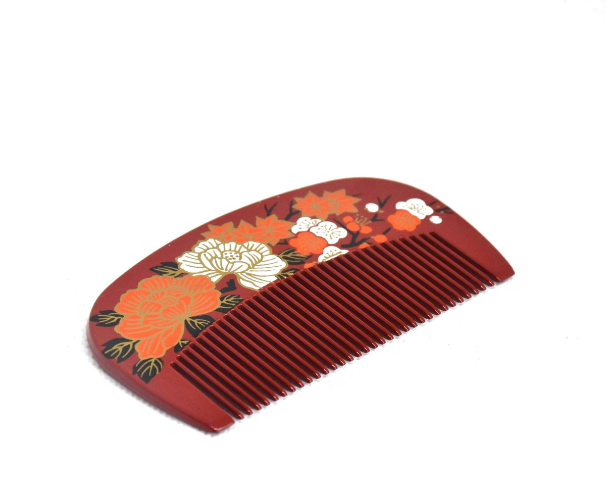 Toyama decorative hair comb featuring a glossy lacquer finish and vibrant floral pattern