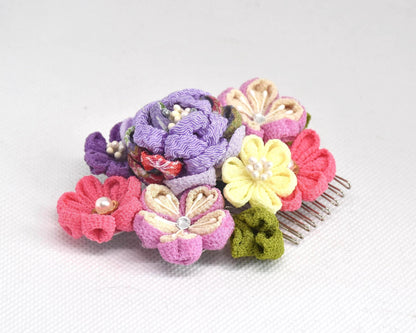 Tsumami-Zaiku Chirimen Crepe Flower Hair Comb displayed on a flat surface from a low angle