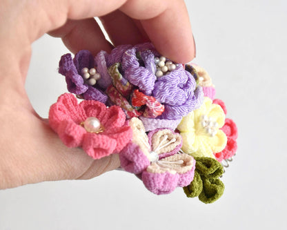Tsumami-Zaiku Chirimen Crepe Flower Hair Comb held at an angle showing texture details