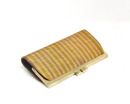 Kihachijo silk coin purse angled view showing gold-tone metal frame and kiss-lock