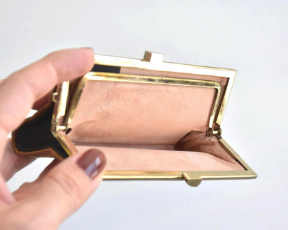 Kihachijo silk coin purse open interior with divider compartment held in hand