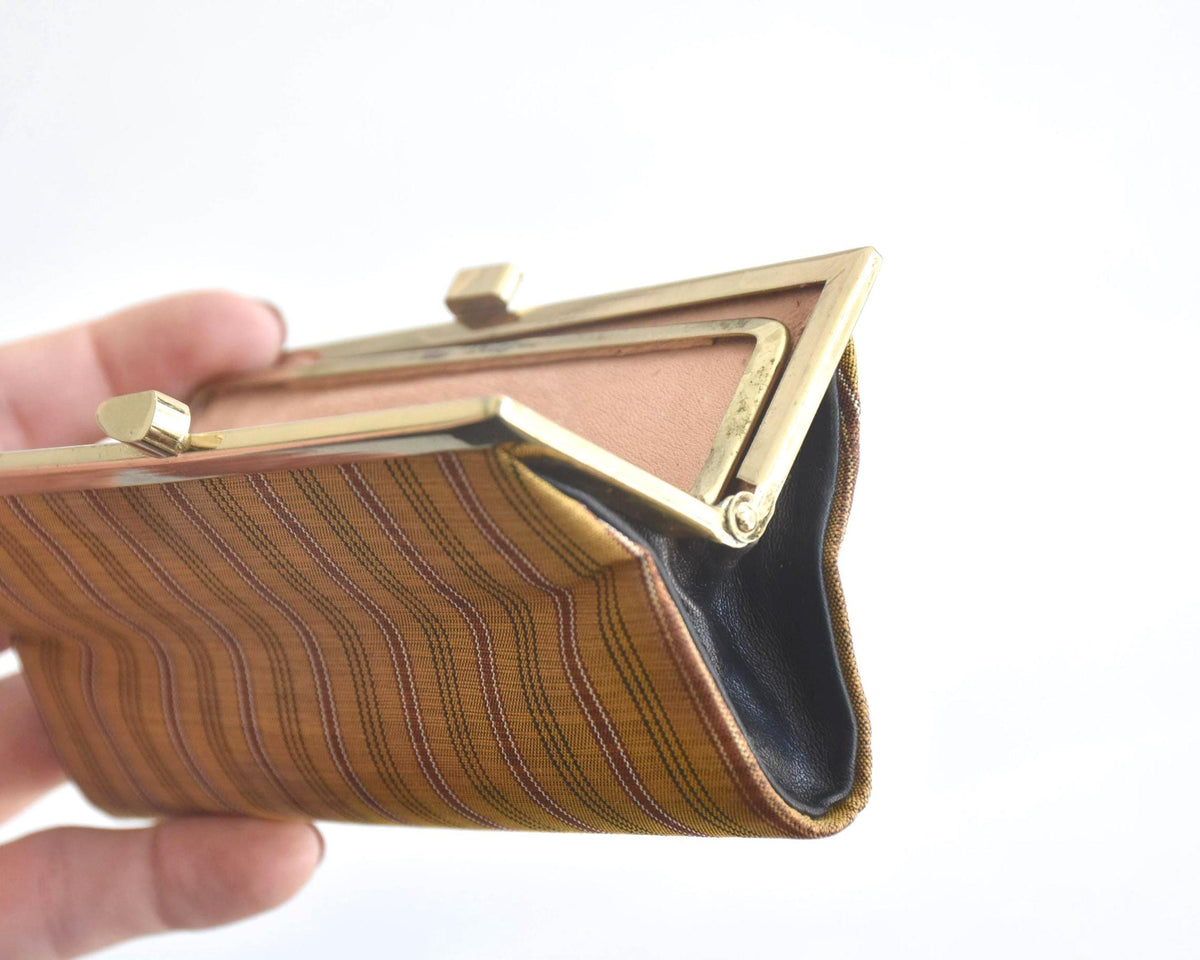 Kihachijo silk coin purse side view showing gusset and gold-tone frame hinge