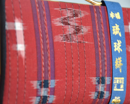 Ryukyu Kasuri Geometric Ikat Silk Wallet Red pattern detail showing the ikat weaving