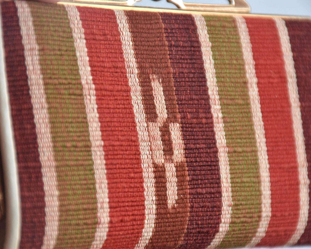 Yaeyama Minsa-Ori coin purse close-up on the kasuri resist-dye woven pattern and ribbed texture