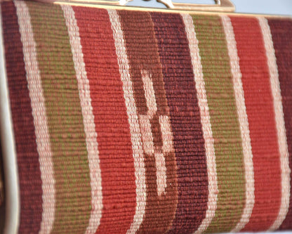 Yaeyama Minsa-Ori coin purse close-up on the kasuri resist-dye woven pattern and ribbed texture