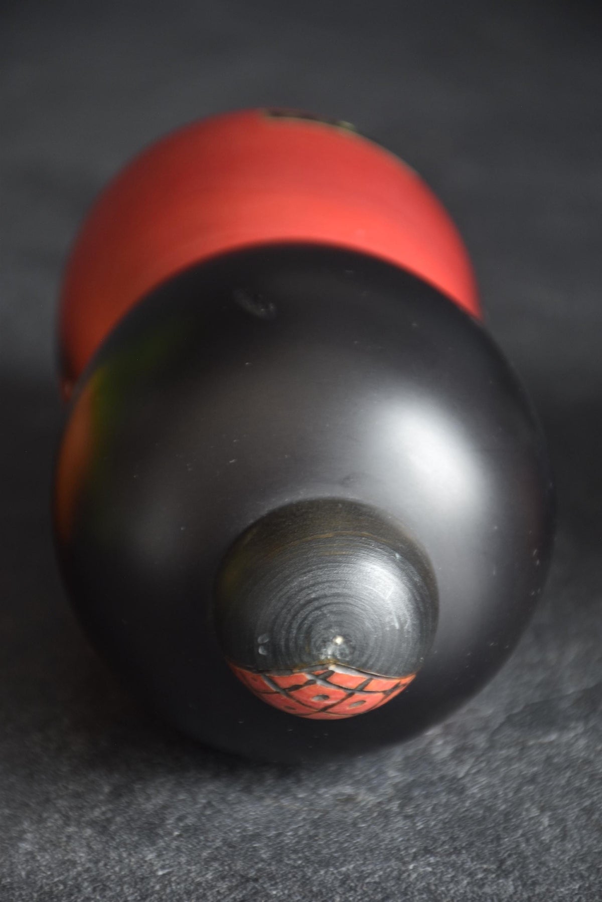 Masae Fujikawa kokeshi doll top view showing textured hair bun and black bob