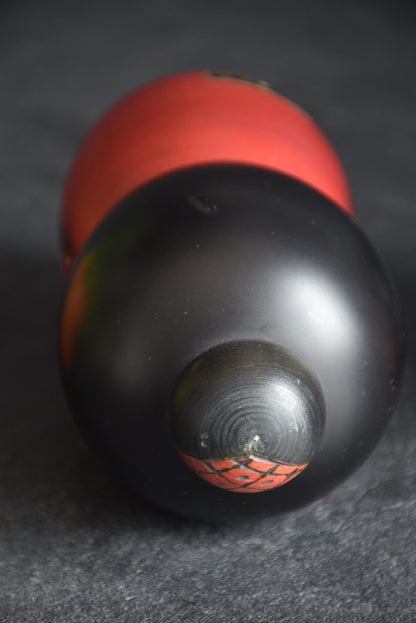 Masae Fujikawa kokeshi doll top-down angle view of the wooden head and bun