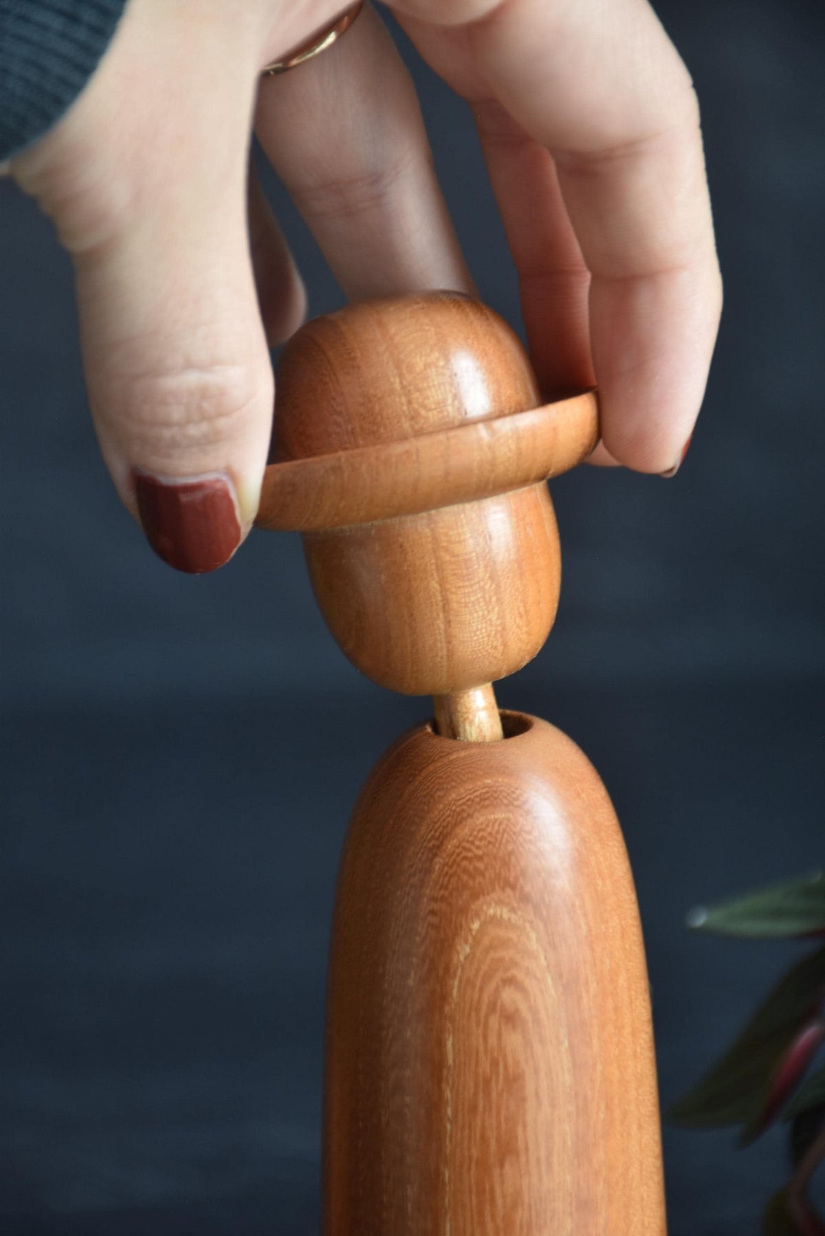 Kenji Miyazawa Dekunobo Kokeshi Doll neck joint being adjusted by hand