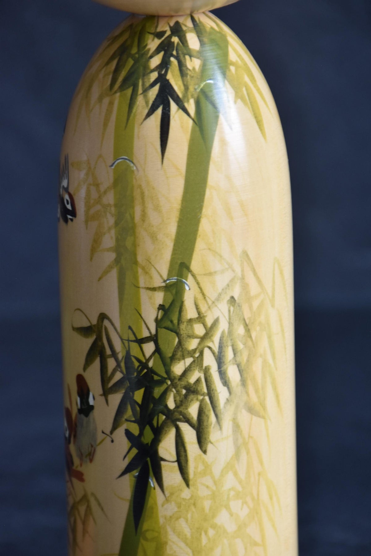 Japanese kokeshi dolls bamboo and floral motif cylindrical body showing detailed botanical design