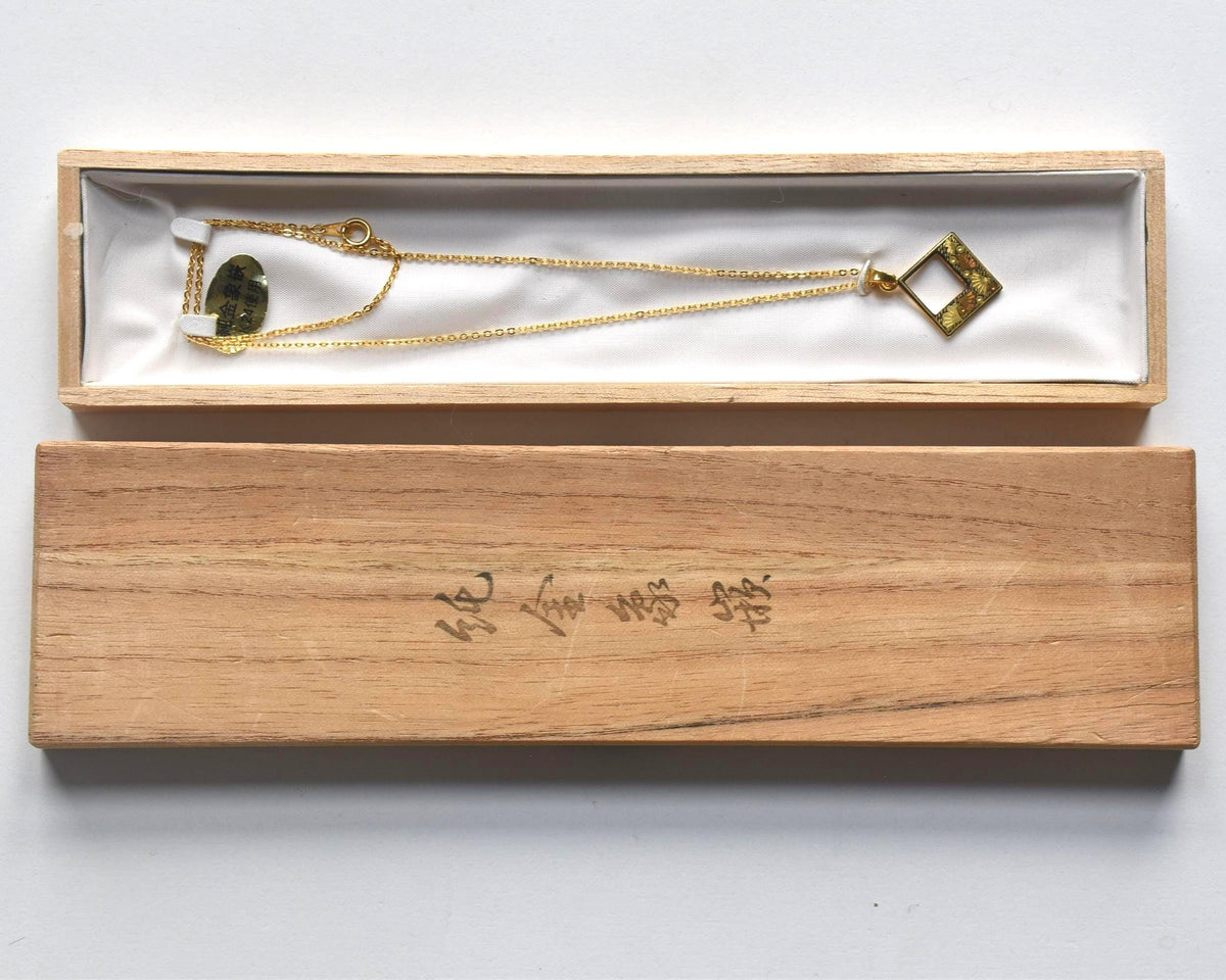 Floral Zogan Damascene Inlay Gold Necklace displayed inside its original wooden box