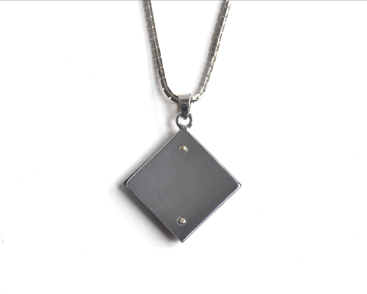 Japanese Zogan Floral Damascene Pendant Necklace showing the back of the square pendant
