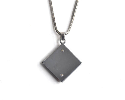 Japanese Zogan Floral Damascene Pendant Necklace showing the back of the square pendant
