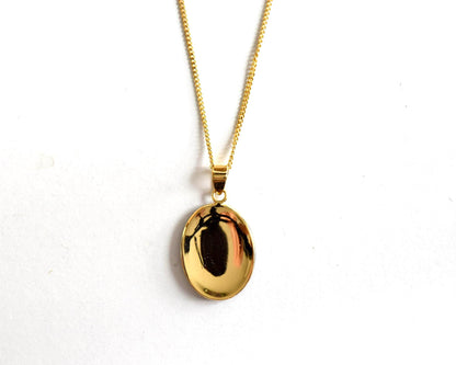 Japanese Zogan floral pendant necklace showing the polished back of the pendant