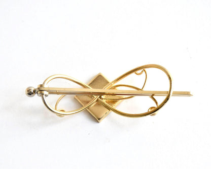 Floral Zogan Damascene Hair Ornament Gold And Black back view showing the metal clasp mechanism