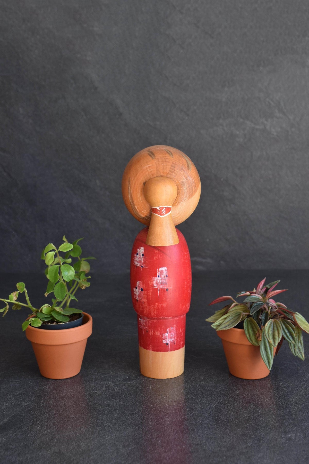 Hajime Miyashita kokeshi doll viewed from the back showing wooden texture