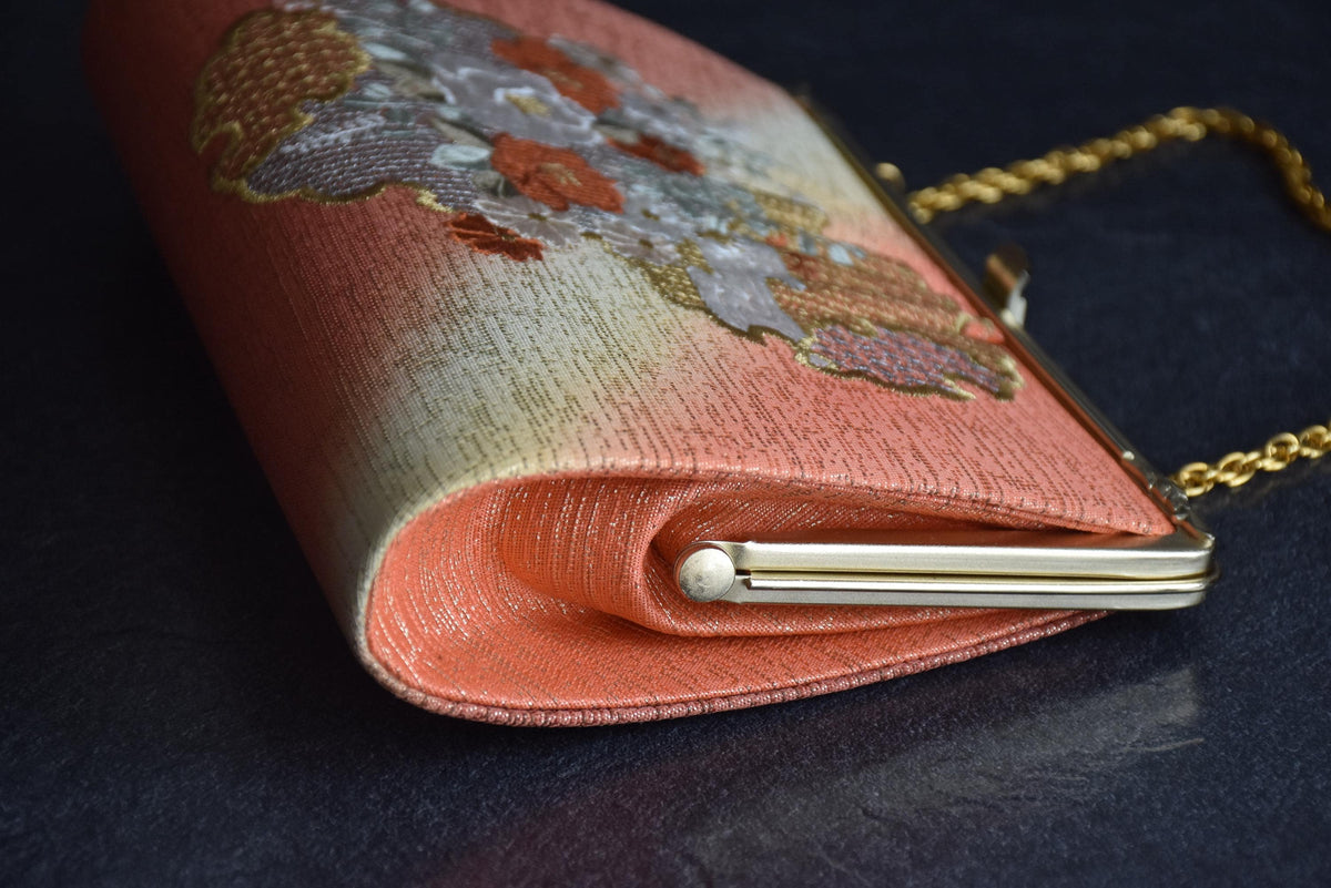 Floral Woven Kimono Clutch side view showing the depth and hinge of the metal frame
