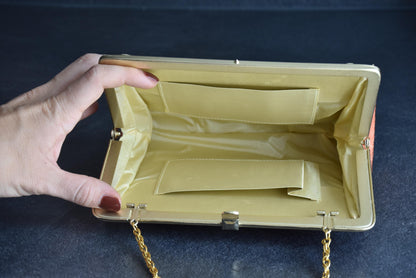 Floral Woven Kimono Clutch open interior view held by a hand showing pockets and lining